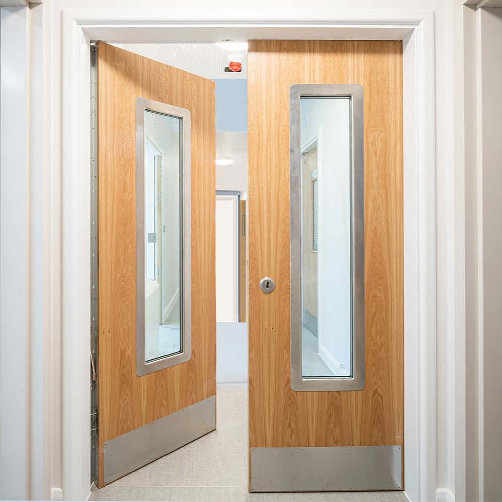 Two Anti Ligature Doors in a Behavioral Health Corridor.