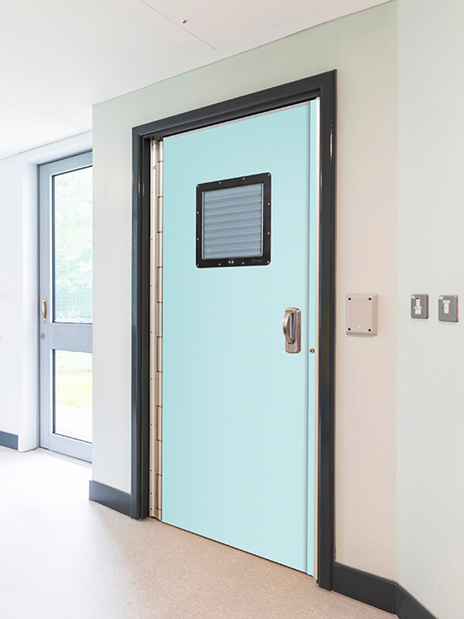 A ligature monitoring door system with anti-barricade capabilities, manufactured by Kingsway Group; a company specializing in ligature-resistant products to improve patient safety in behavioral health.