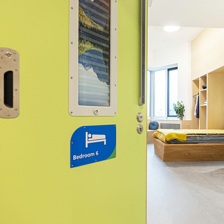 Mental Health bedroom with an Anti Barricade Door.