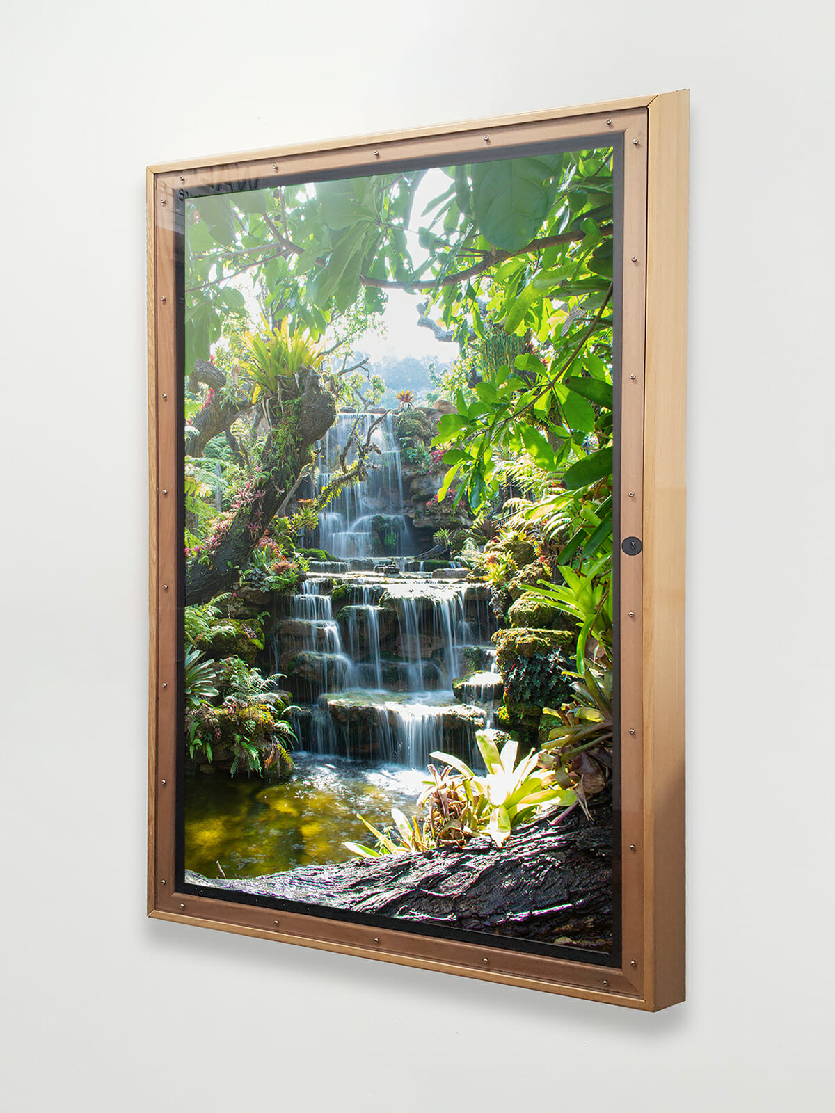 Kingsway's SERENITY Interactive Panel displaying a therapeutic waterfall within a rainforest.