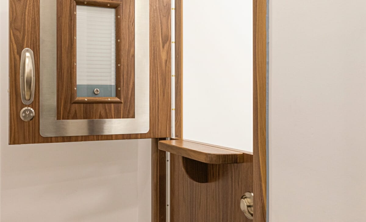 STABLE Split Leaf Door System with foldable shelf to the staff side and clinic room hatch.