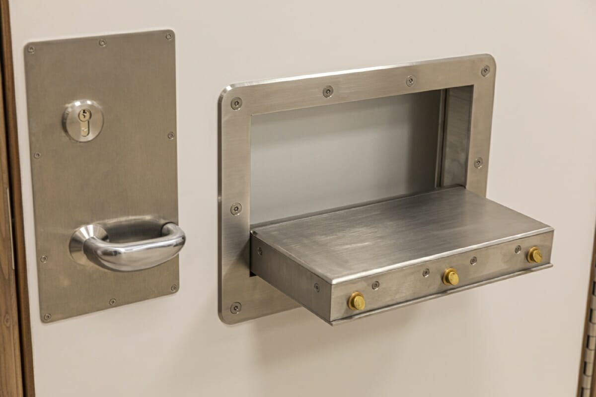 The SECLUSION Door System featuring a high secure serving hatch to allow items to be safely passed to isolated patients.