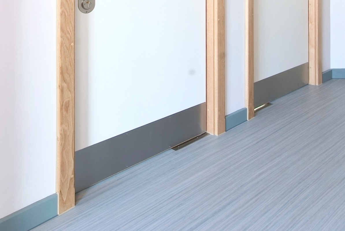 The KG110 kick plate offers optimal functionality with a sleek appearance for behavioral health facility doors.