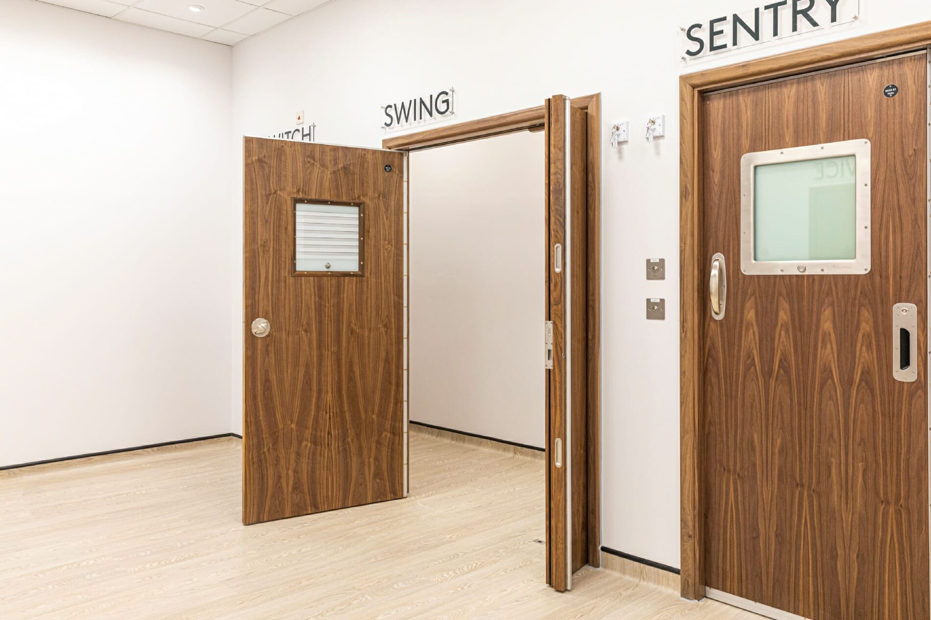 SWING Anti-Barricade Door System with leaf and half leaf open for wide access.